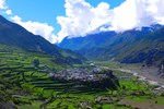In the upper valley of Manang district, the village of Thulo Manang sits on a raised plateau surrounded by farmland on which buckwheat and potatoes are grown.