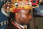 Chiefs in Eleme are responsible for presiding over different parts of the territory. Emere Emeperor Nkpe dons a contemporary ceremonial hat associated with his status in the community.